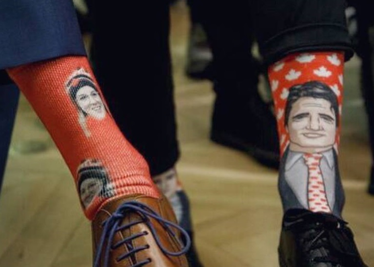 Cassie Sharpe gifts Justin Trudeau socks, with her face on them