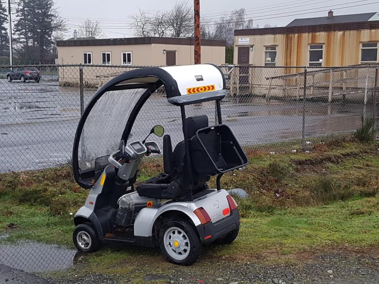 Electric scooter left out by Thunderbird Hall, resident looking for owner