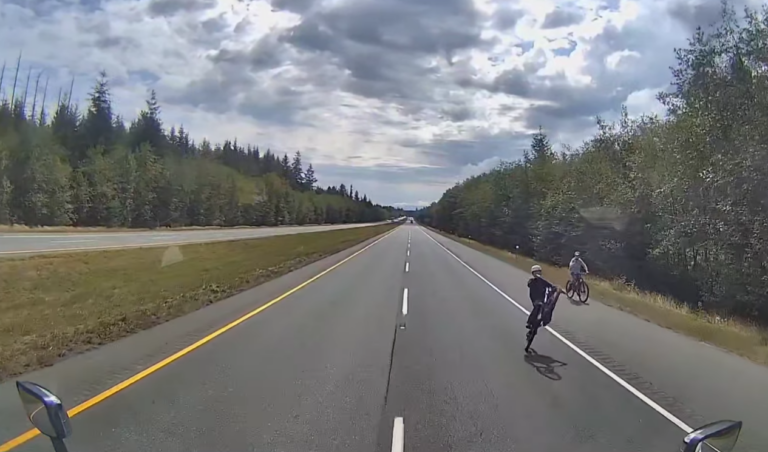 Dangerous bike stunt in front of semi truck caught on dashcam